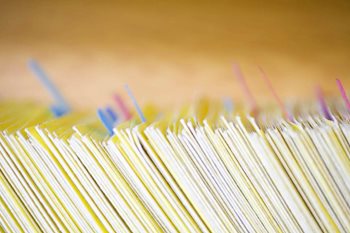 GDPR: Paper records of confidential customer details stored across different color coded folders