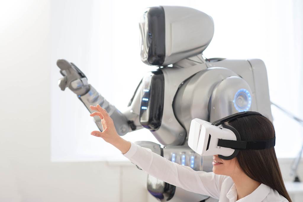 Employee testing augmented and virtual reality technology in the workplace