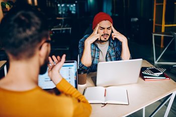 Stressed end-user struggling to use the IT self-service portal to solve issues on their laptop
