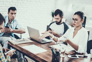 Female manager asking her managed service provider (MSP) key questions about their services